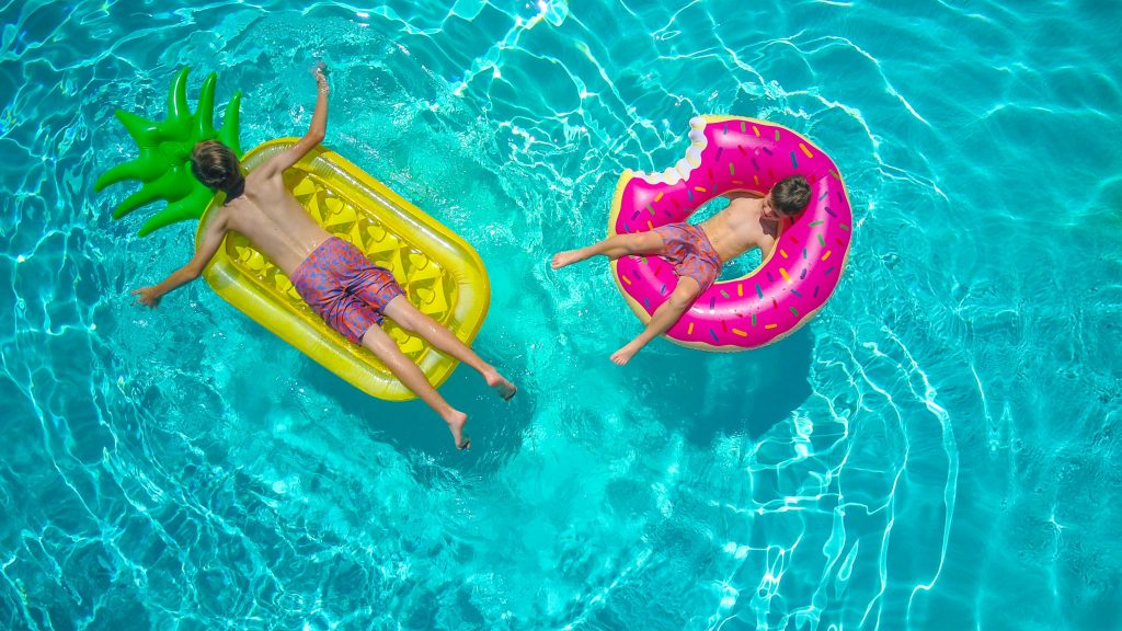 two people floating on a pool float